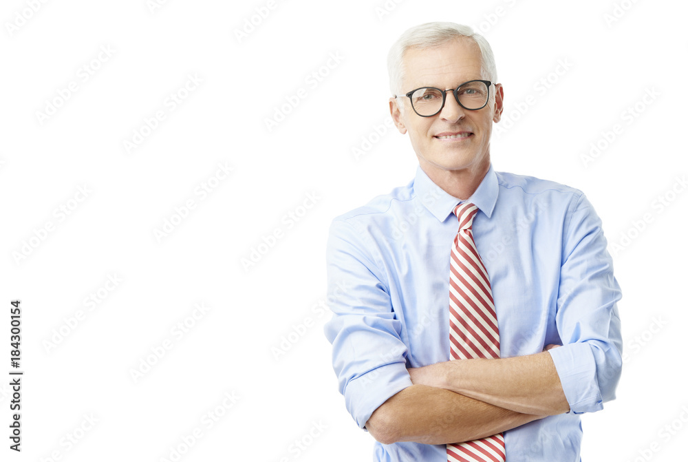 Senior businessman wearing shirt and tie and smiling while standing against at isolated white background. Senior businessman wearing shirt and tie and smiling while standing against at isolated white background.
