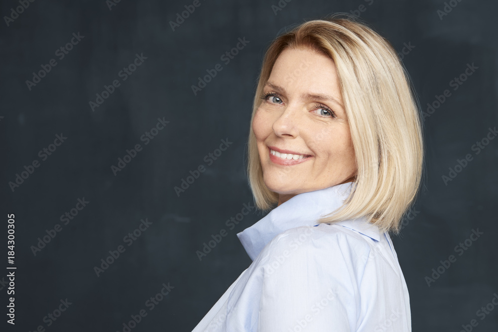 Fototapeta premium Vitality at any age. Studio shot a beautiful elderly woman standing at dark background and laughing while looking at you
