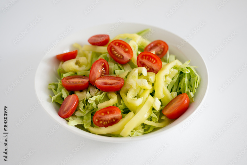 White plate with vegetable salad