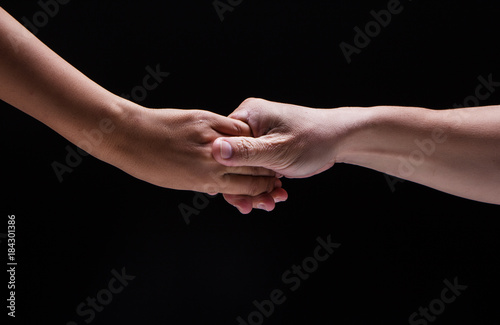Closeup human hand touch together.