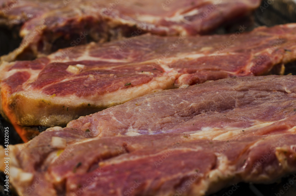Baking fresh meat on grill closeup Baking fresh meat on grill closeup