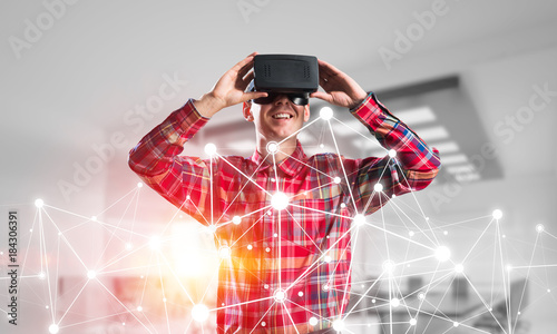 Guy wearing checked shirt and virtual mask demonstrating some emotions © adam121