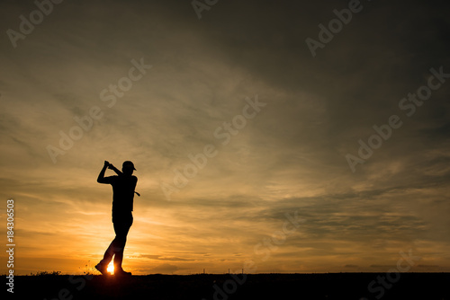 Fototapeta Naklejka Na Ścianę i Meble -  silhouette asian golfer playing golf during beautiful sunset