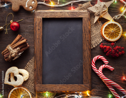 chalkboard gingerbread Christmas tree and gifts on table (top view) © Chepko Danil