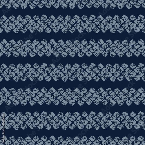 Japanese Shibori ornament. Asian seamless pattern. Horizontal motif. Dark indigo background. Classic japanese dyeing technique. Plain backdrop for decoration, wallpaper or handiwork.