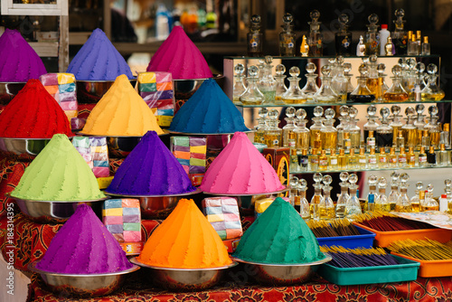Holi color powders, spices and incense at the street market in Kochi, India photo