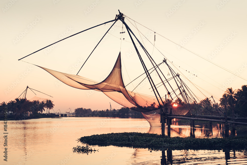 Chinese fishing nets on sunset background in Cochin, Kerala, India