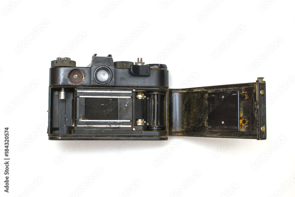 old SLR camera rusted from falling into the water, on a white isolated background