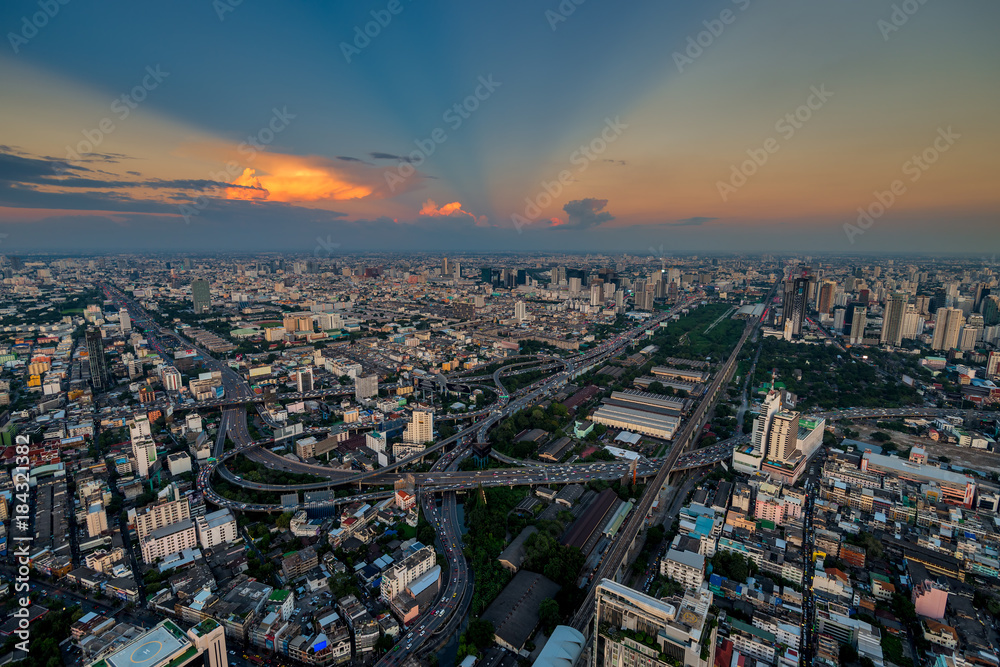 road junction and bridges, cars and traffic at sunset in Bangkok