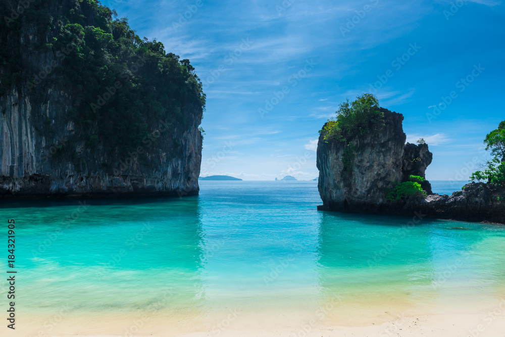calm turquoise sea between steep cliffs beautiful seascape of Thailand