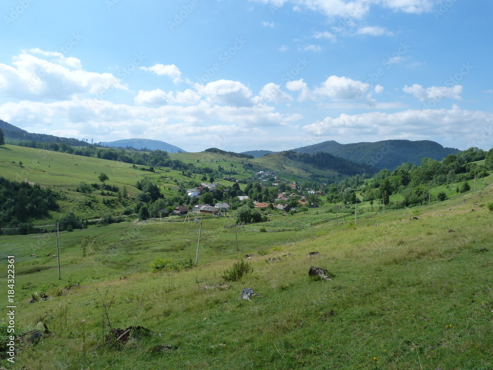 The landscape of the mountain village Volovets, surrounded by the Carpathian Mountains.