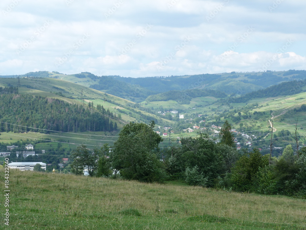 The landscape of the mountain village Volovets, surrounded by the Carpathian Mountains.