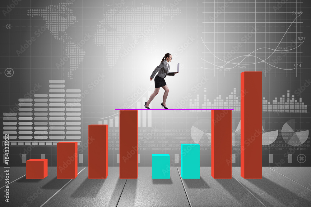 Young businesswoman in business concept with bar charts Young businesswoman in business concept with bar charts