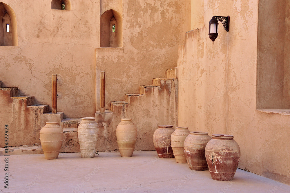 Inner court of Jabrin Castle with typical painted pottery, Fort of Jabrin, Sultanate of Oman Inner court of Jabrin Castle with typical painted pottery, Fort of Jabrin, Sultanate of Oman