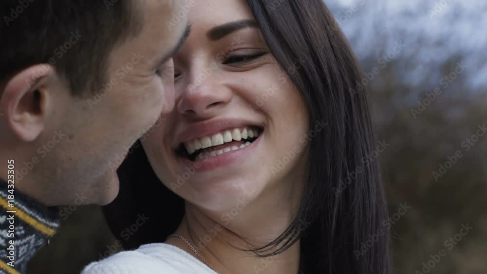 Close up of handsome man kissing his girl Close up of handsome man kissing his girl
