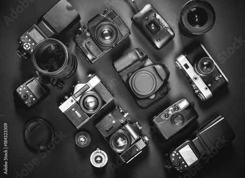 Collection Vintage Film And Digital Cameras, On Black Background, Top View