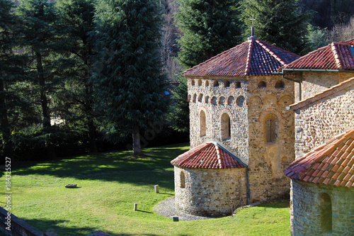 Romanesque baptistery and church surrounded by nature (basilica of Agliate medieval complex)