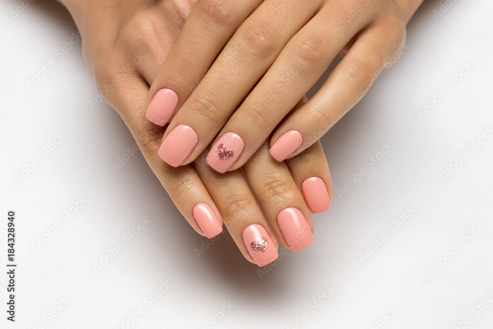 pink manicure with golden hearts on nameless fingers on short nails
pink manicure with golden hearts on nameless fingers on short nails