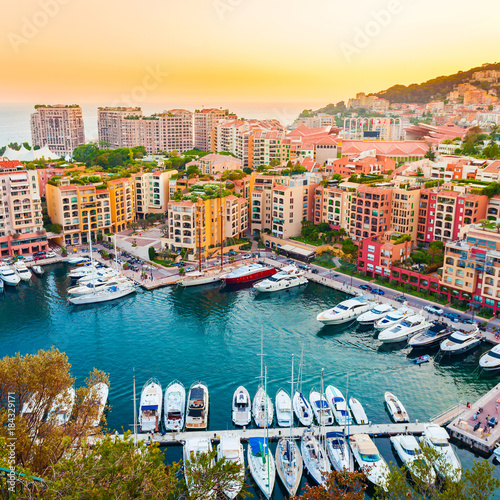 Panoramic view of Port de Fontvieille in Monaco. Azur coast. Colorful bay with a lot of luxury yachts in sunset. © LALSSTOCK