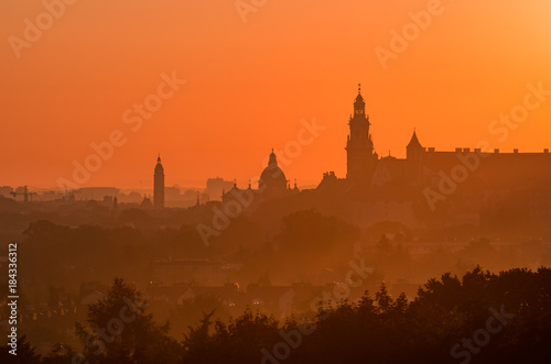 Krakow, Poland, Wawel castle silhouette at sunrise © tomeyk