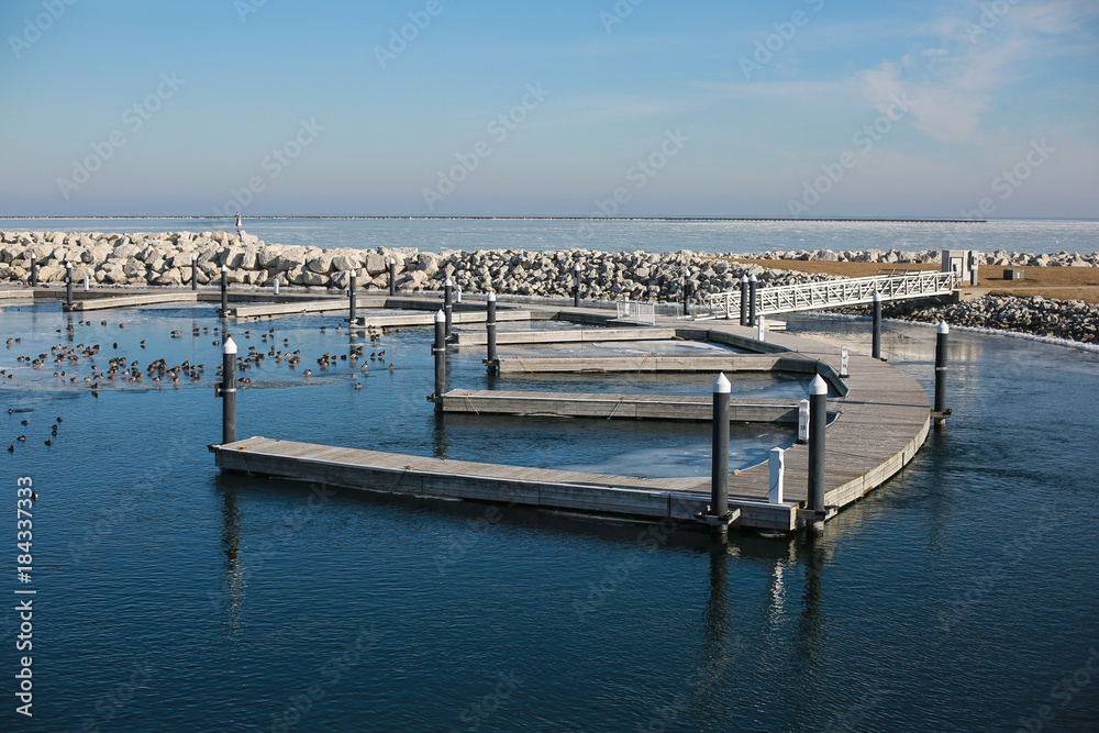 Fototapeta premium empty pier on the lake in winter
