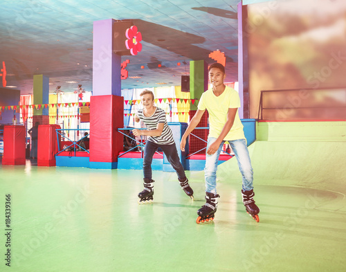 Teenage boys at roller skat...