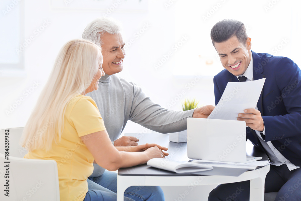 Senior couple meeting with consultant in office Senior couple meeting with consultant in office