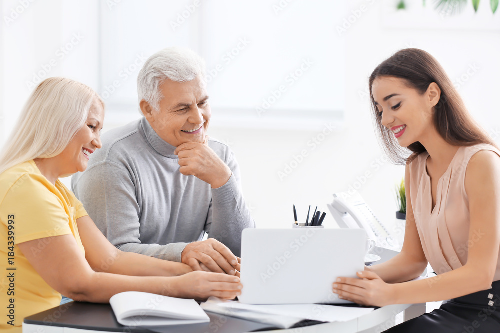 Senior couple meeting with consultant in office Senior couple meeting with consultant in office