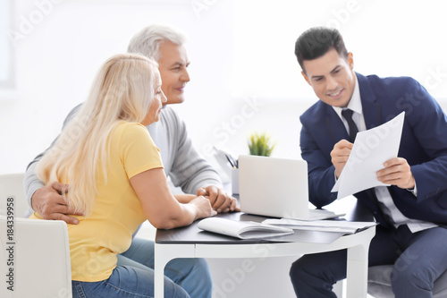 Senior couple meeting with ...
