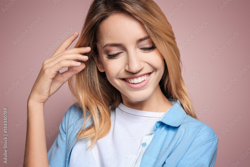 Smiling woman in casual clothes on color background Smiling woman in casual clothes on color background