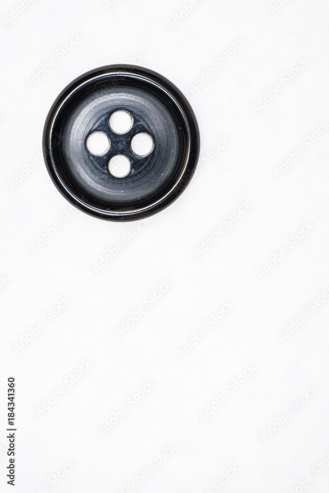 Sewing buttons on white background close up Sewing buttons on white background close up