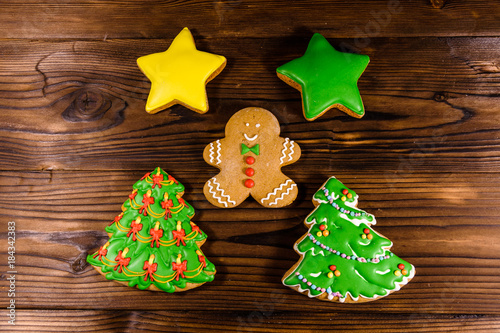 Different christmas gingerbread cookies on wooden table. Top view