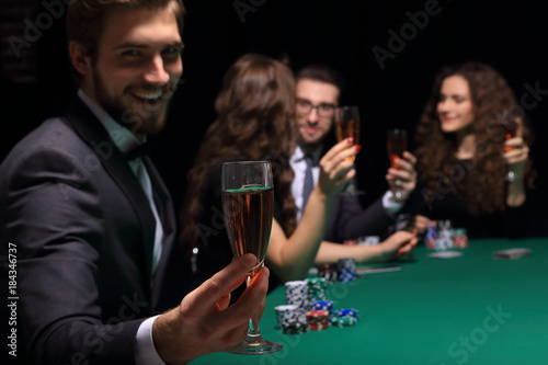 poker player with a glass of wine