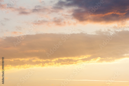 Sky background or texture at the sunset time with clouds. Copy space