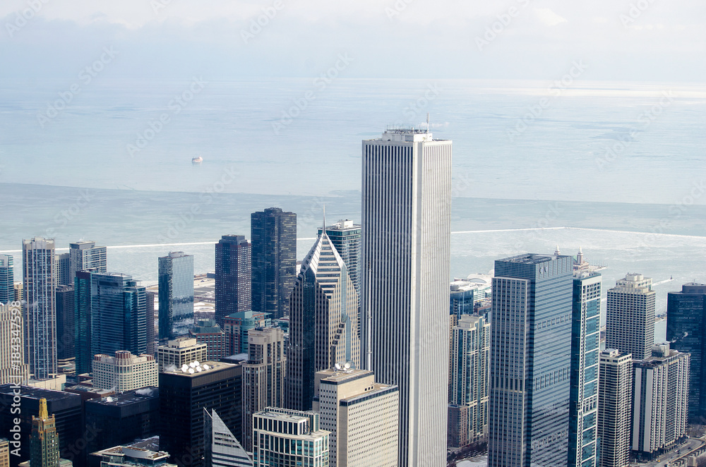 aerial view of Chicago cityscape with frozen Lake Michigan background