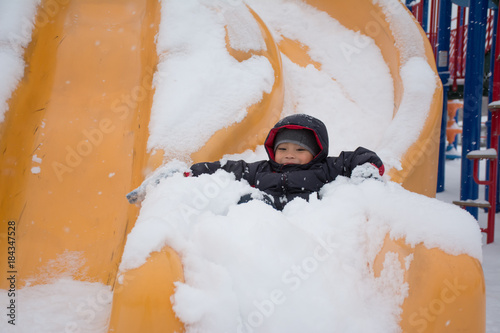 Sliding down the slide on the snow day.  First Snow Fall was amazing.