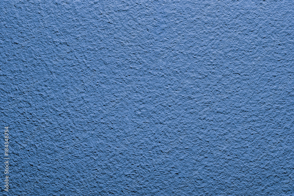 Blue paint closeup wall pattern background.
