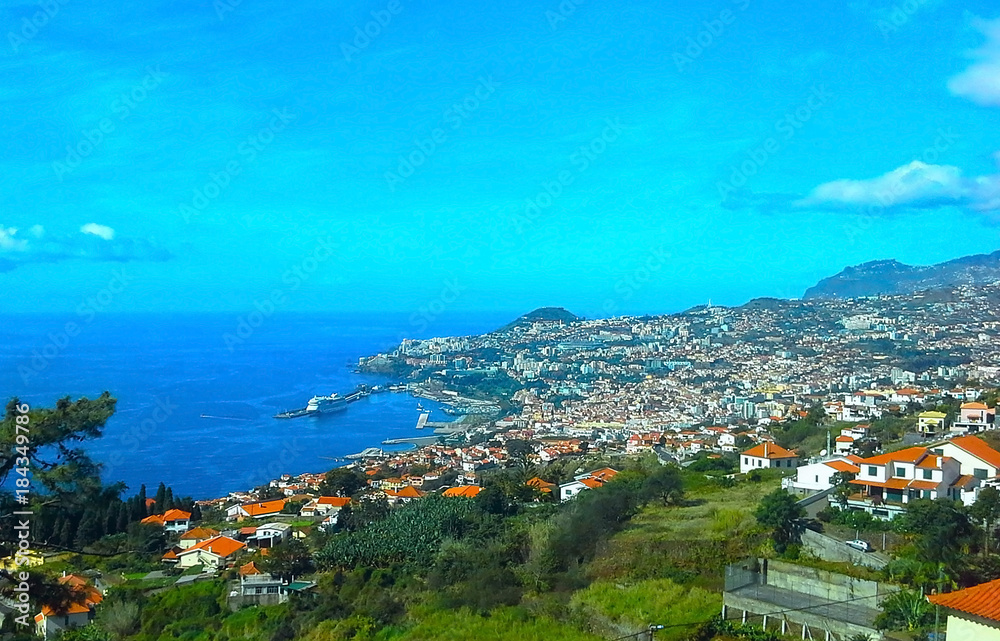 view of the Madeira island from the hill, Portugal. Seafront houses of Funchal