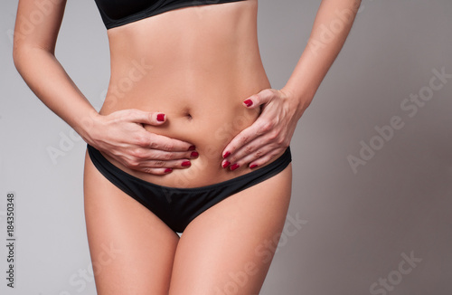 Body care. Pain. Woman has stomach ache © Dmytro Flisak
