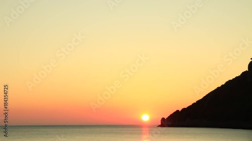 Scenic sunrise sun rising over sea surface, Greece Peloponnese Lakonia, Vlychada Beach, Richea. Time lapse photo