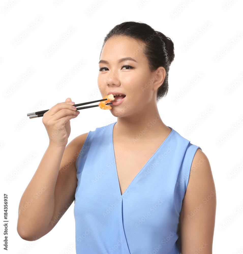 Beautiful Asian woman eating shrimp on white background Beautiful Asian woman eating shrimp on white background