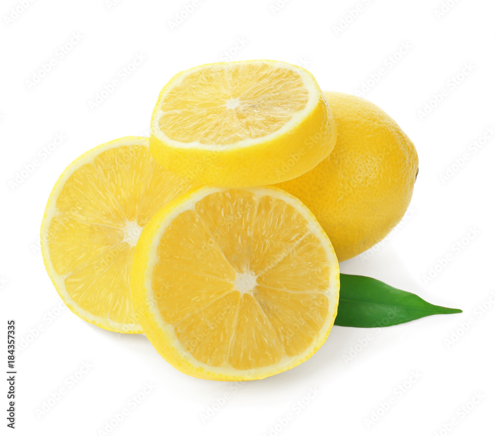 Fresh ripe lemon and slices on white background