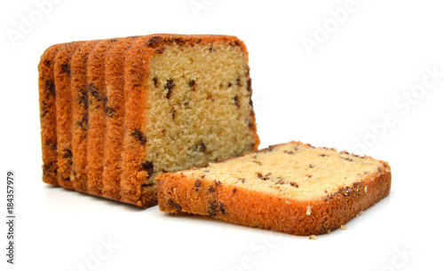 Sliced butter cake on white background photo