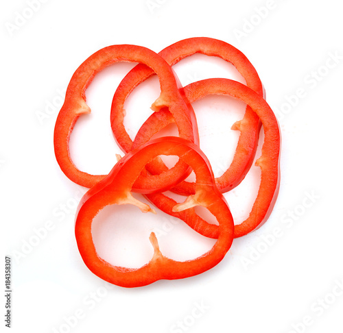 Red sweet bell pepper slices isolated on white background cutout photo