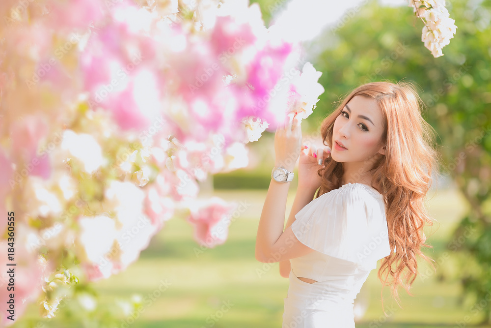 Beautiful asian young bride outdoors in a forest. Pretty Thai girl in garden.