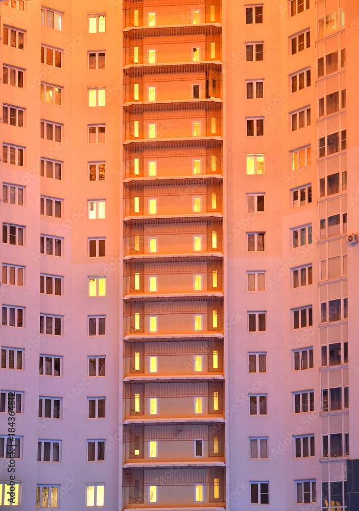 electric light in the Windows of an apartment building