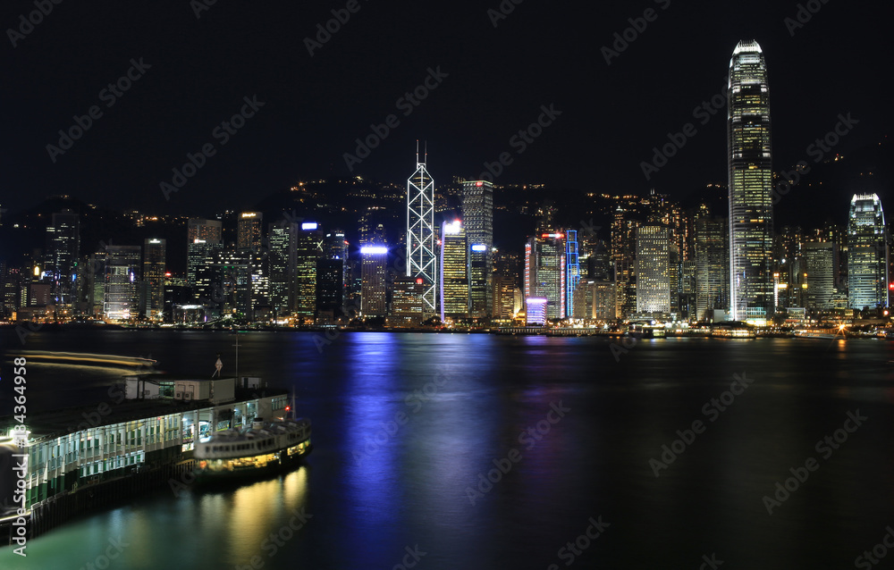 Tsim Sha Tsui Ferry Pier, busy victoria harbour and the skyline of hong kong island at night
