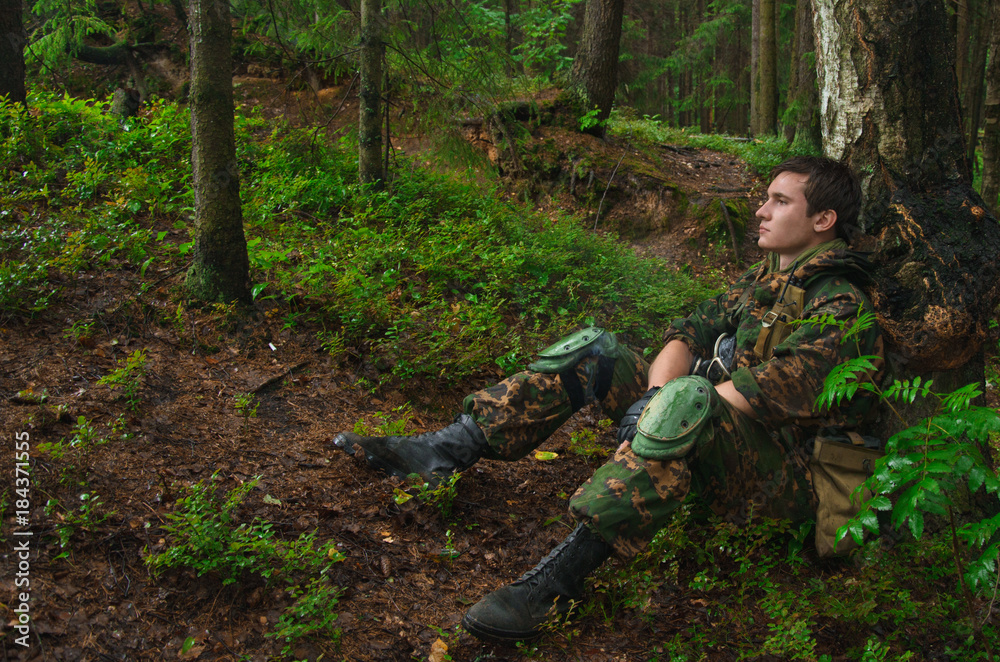 Soldiers resting in woods