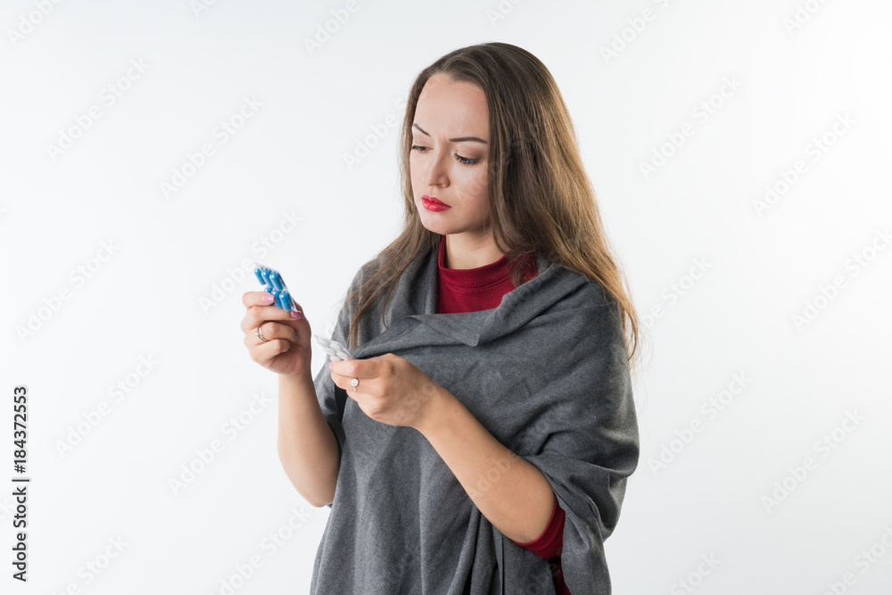 Choice of medicine between different pills and capsules. Woman holds two types of drugs Isolated on a white background with copyspace Choice of medicine between different pills and capsules. Woman holds two types of drugs Isolated on a white background with copyspace