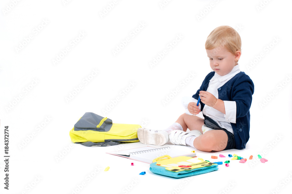 Happy little schoolgirl. Child with backpack and books. Happy little schoolgirl. Child with backpack and books.